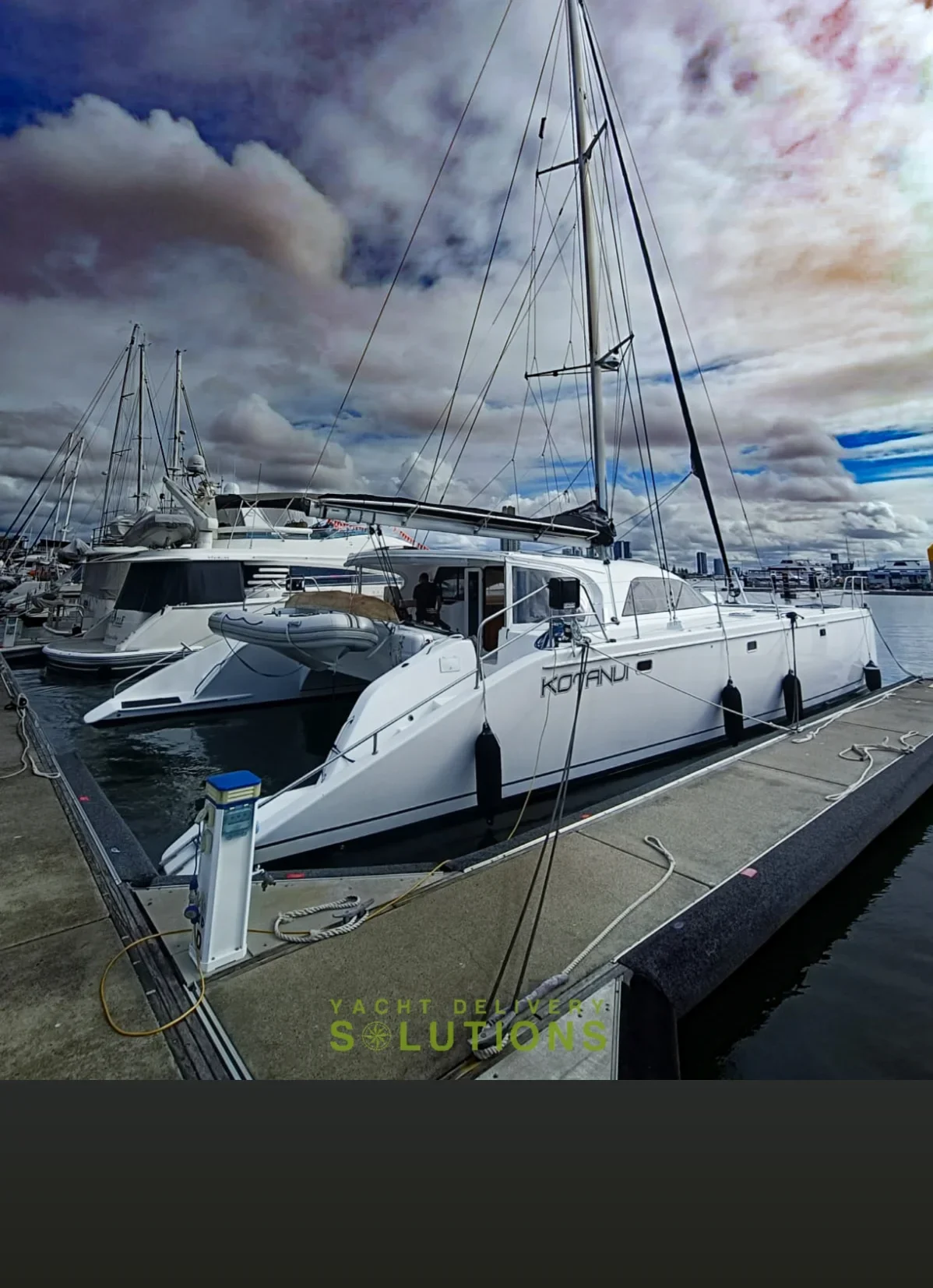 Grainger 52 on the dock in QLD with blue sky and white clouds