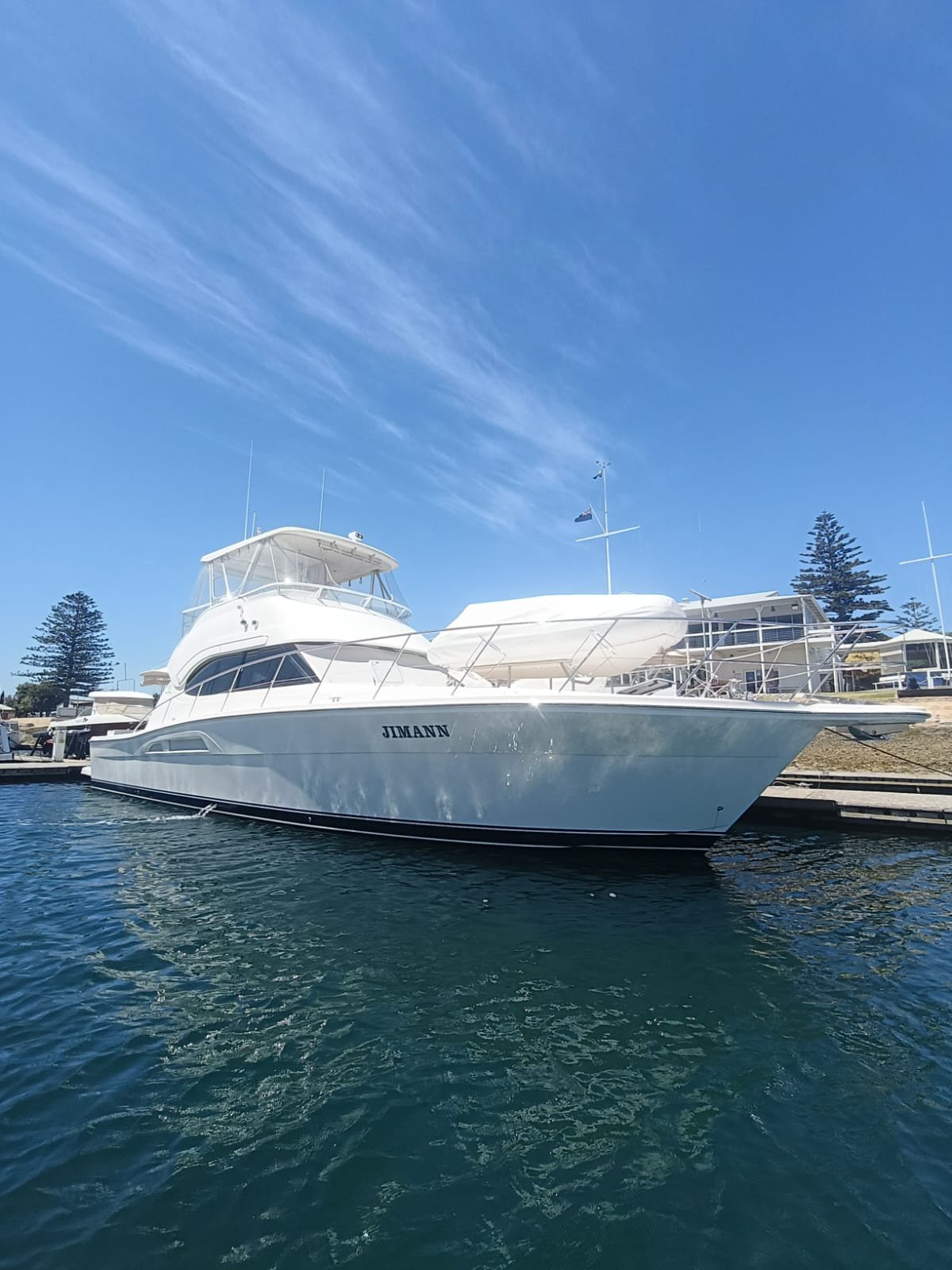 white Riviera motor yacht on the dock after the gold coast yacht delivery