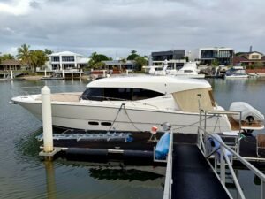 White Maritimo S51 showing the port side with cloudy background as its prepared for a yacht delivery