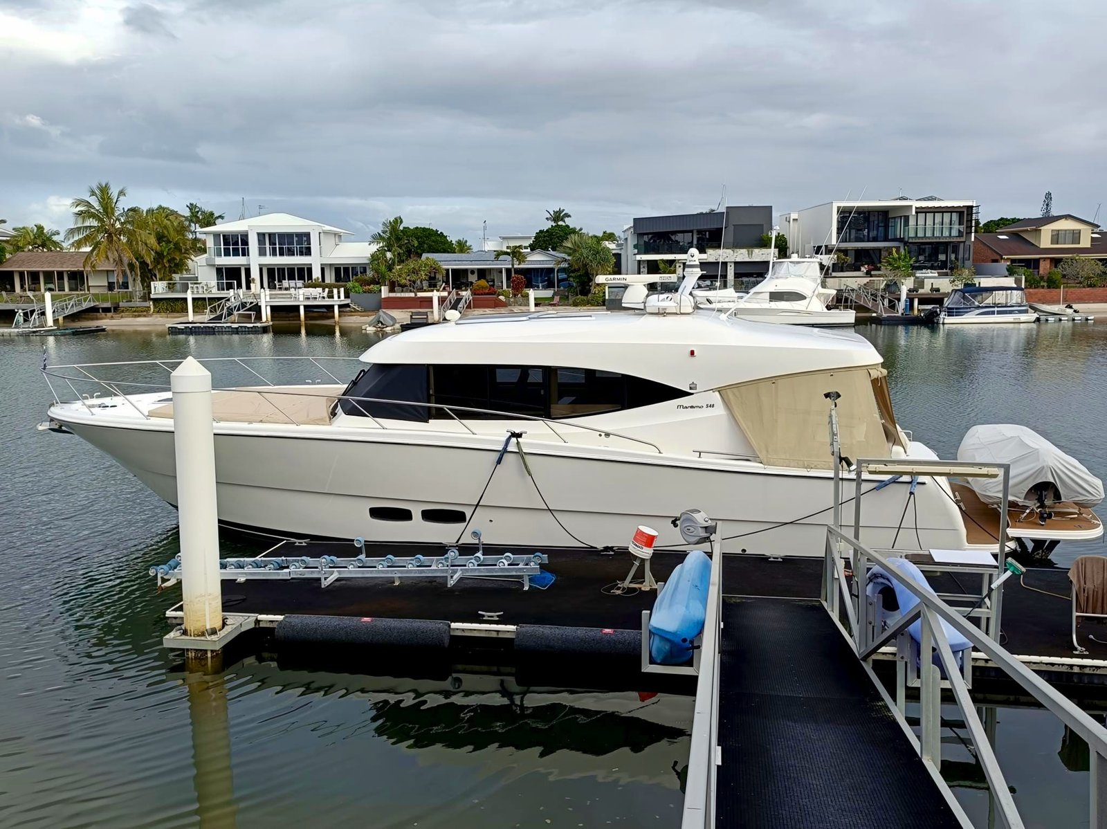 White Maritimo S51 showing the port side with cloudy background as its prepared for a yacht delivery