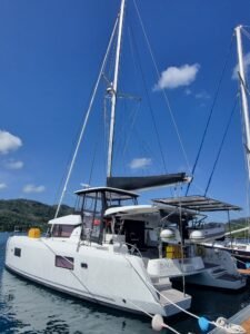 white lagoon 42 with black sail cover on a dock before a yacht delivery