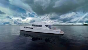 White dickey boats pacific 62 anchored showing the port side during a yacht delivery